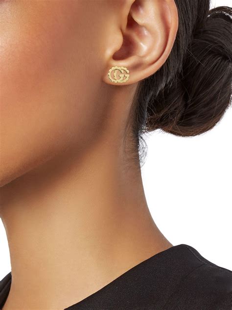 gucci ear studs.